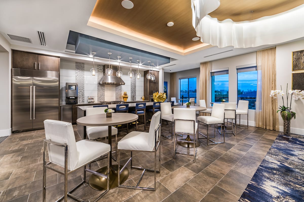 A modern and luxurious kitchen and dining area with sleek design elements.