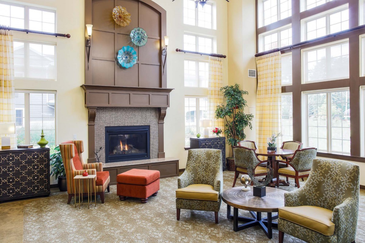 A cozy living room with a fireplace and comfortable seating.