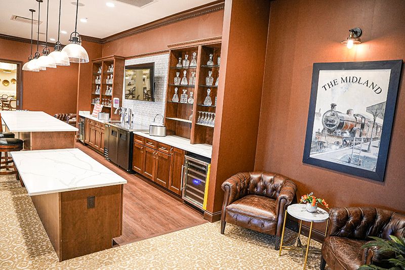 Luxury bar area with wooden paneling and modern furnishings.