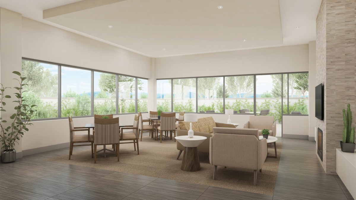 A modern lounge area with ample natural light and comfortable seating.