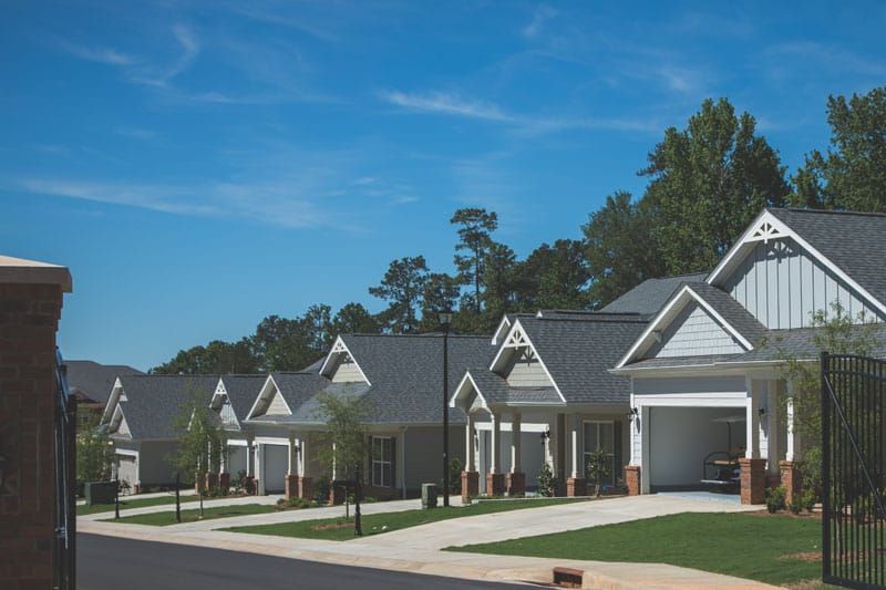 A row of suburban houses in a peaceful neighborhood.