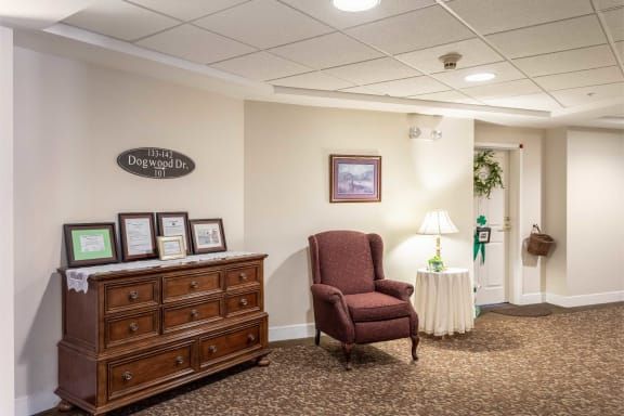 Cozy corner in a warmly decorated room with a comfortable chair and furniture.