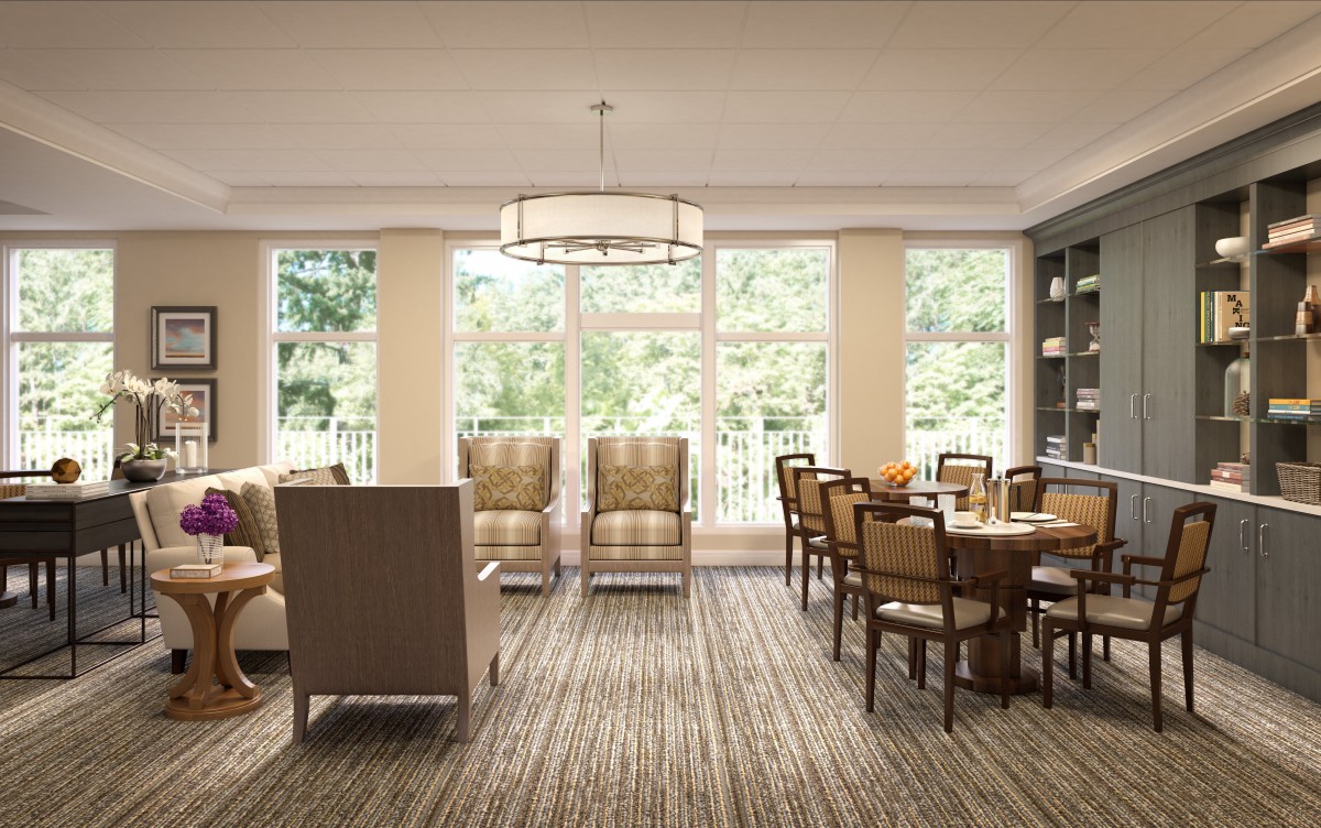 Bright dining room with large windows and traditional furniture.
