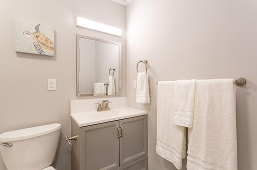 A modern bathroom featuring a stylish vanity and fresh towels.