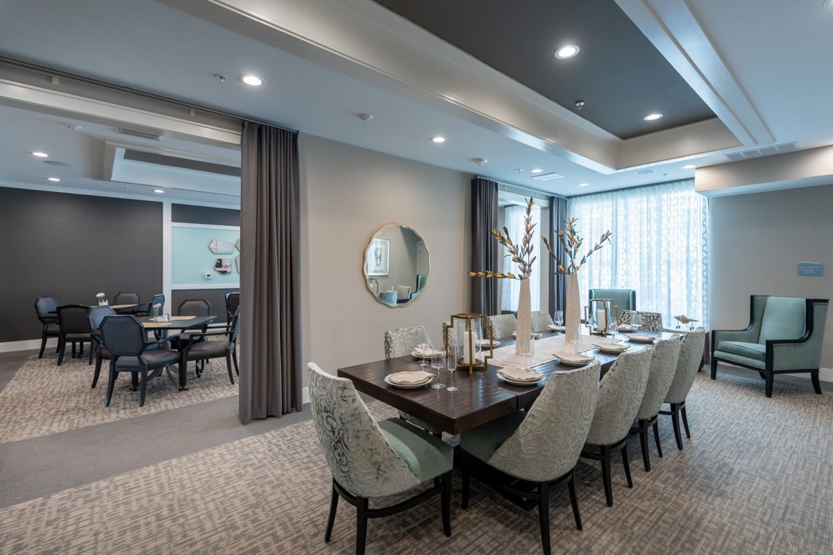 A modern and elegant dining room with stylish furnishings and a sophisticated table setting.