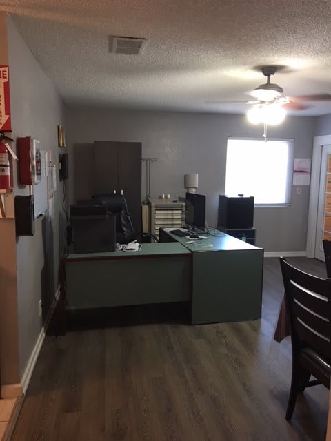 A small office space with a desk and computer.