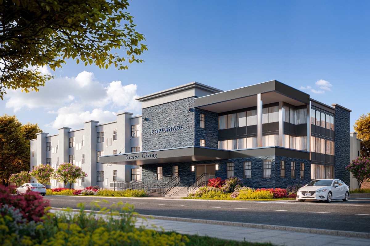A modern hotel building with a sleek architectural design under a clear blue sky.