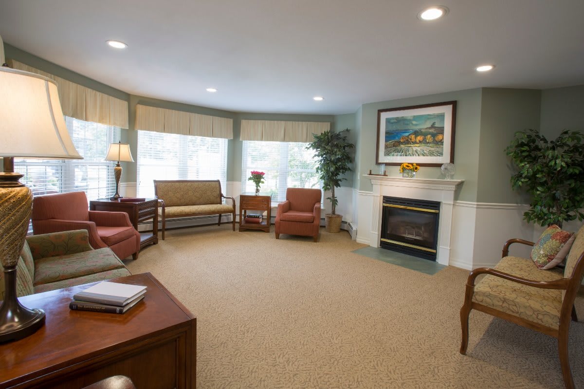 A cozy living room with comfortable seating and a fireplace.