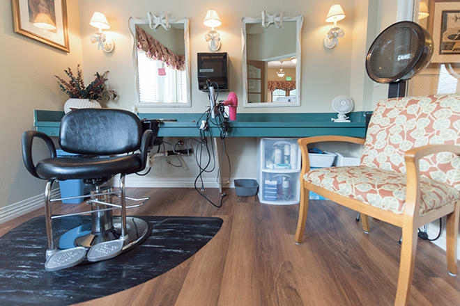 A cozy hair salon interior with styling chairs and mirrors.