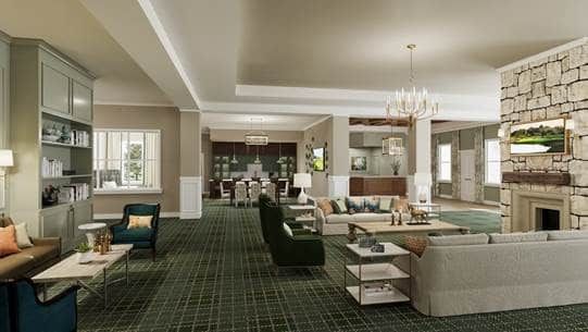 A spacious living room with elegant furniture and a chandelier.