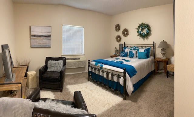 A cozy and modern bedroom with stylish decorations and comfy furniture.