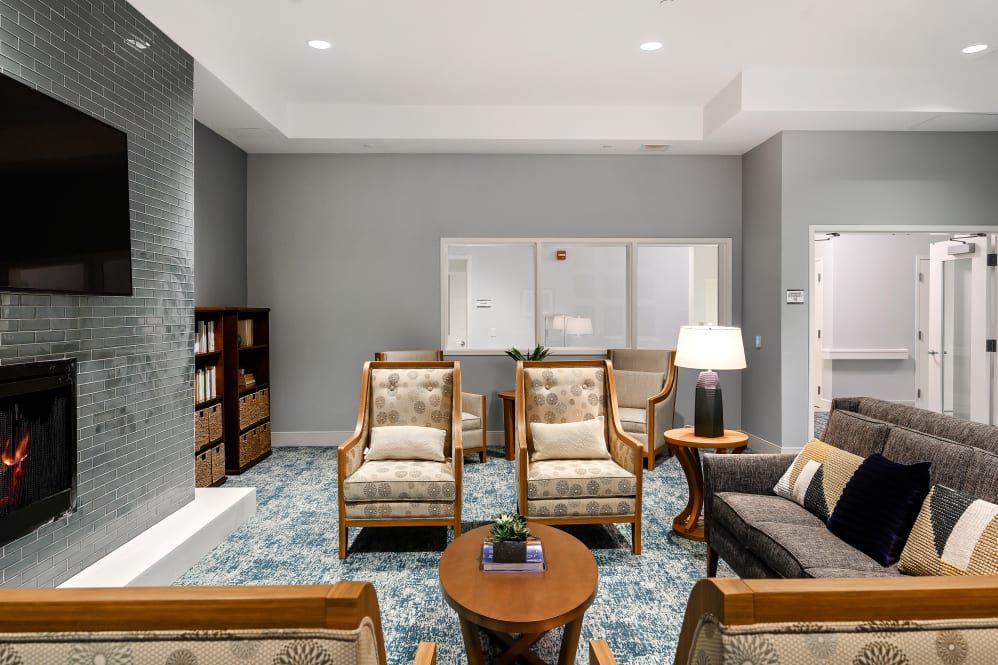 A modern living room with comfortable seating and elegant decor.