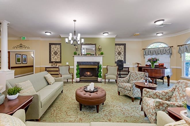 A cozy living room featuring elegant furniture and a fireplace.