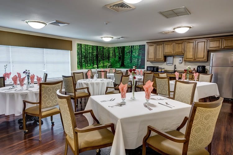 A well-appointed dining area with neatly arranged tables and elegant decor.