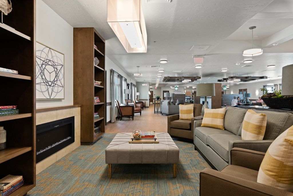 A modern living room with cozy seating, a fireplace, and stylish decor.