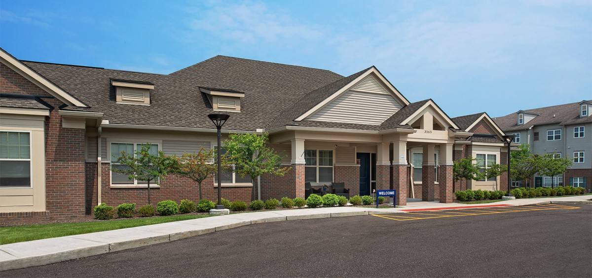 A suburban residential building with well-maintained landscaping.