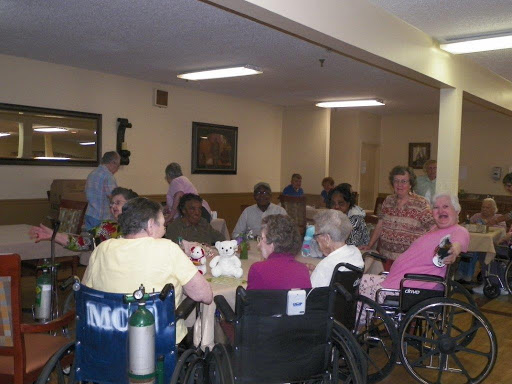 Residents enjoying a social gathering in a care facility.