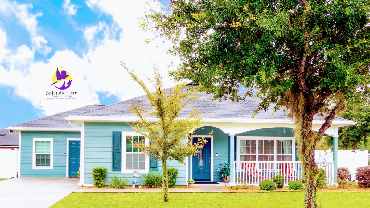 A charming blue house with a welcoming front porch and a small tree in the yard.
