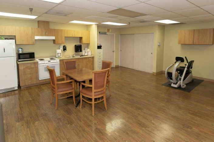 A spacious kitchen and dining area with wooden floors and modern appliances.