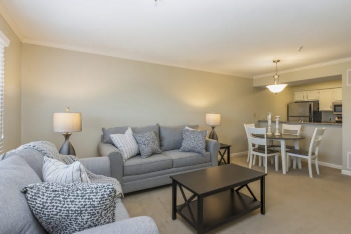 A modern living room with comfortable seating and elegant decor.