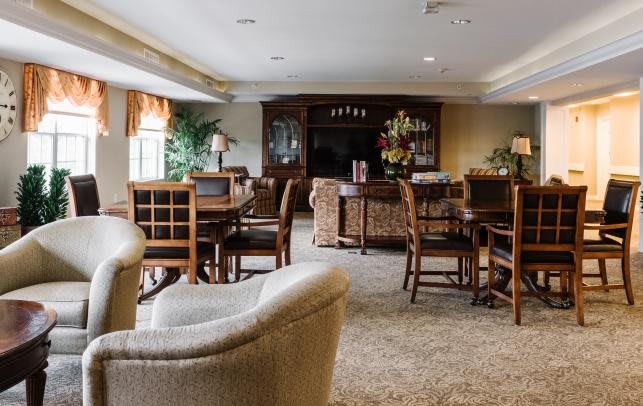 A cozy living room with comfortable seating and elegant decor.