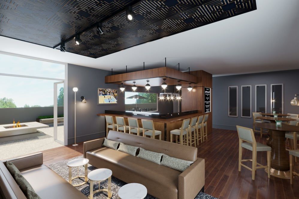 A modern living space featuring a kitchen bar area with stylish seating and contemporary decor.