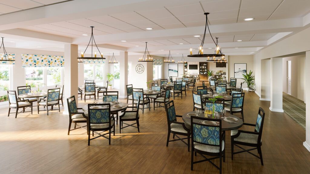 An elegantly designed dining area with neatly arranged tables and chairs under stylish chandeliers.