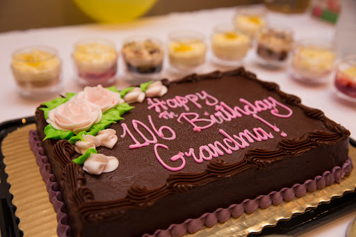 A beautifully decorated chocolate birthday cake celebrating Grandma's 106th birthday!