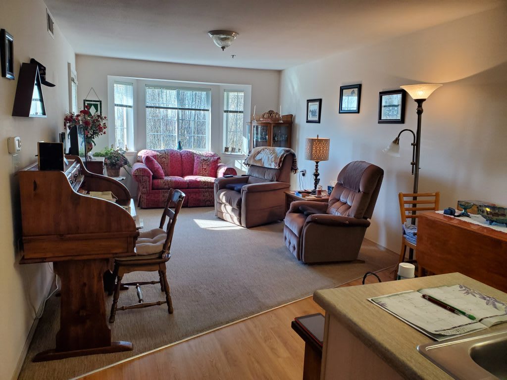 A cozy living room with comfortable seating and natural light.