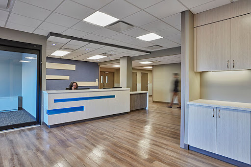A modern reception area featuring a clean design and functional workspace.