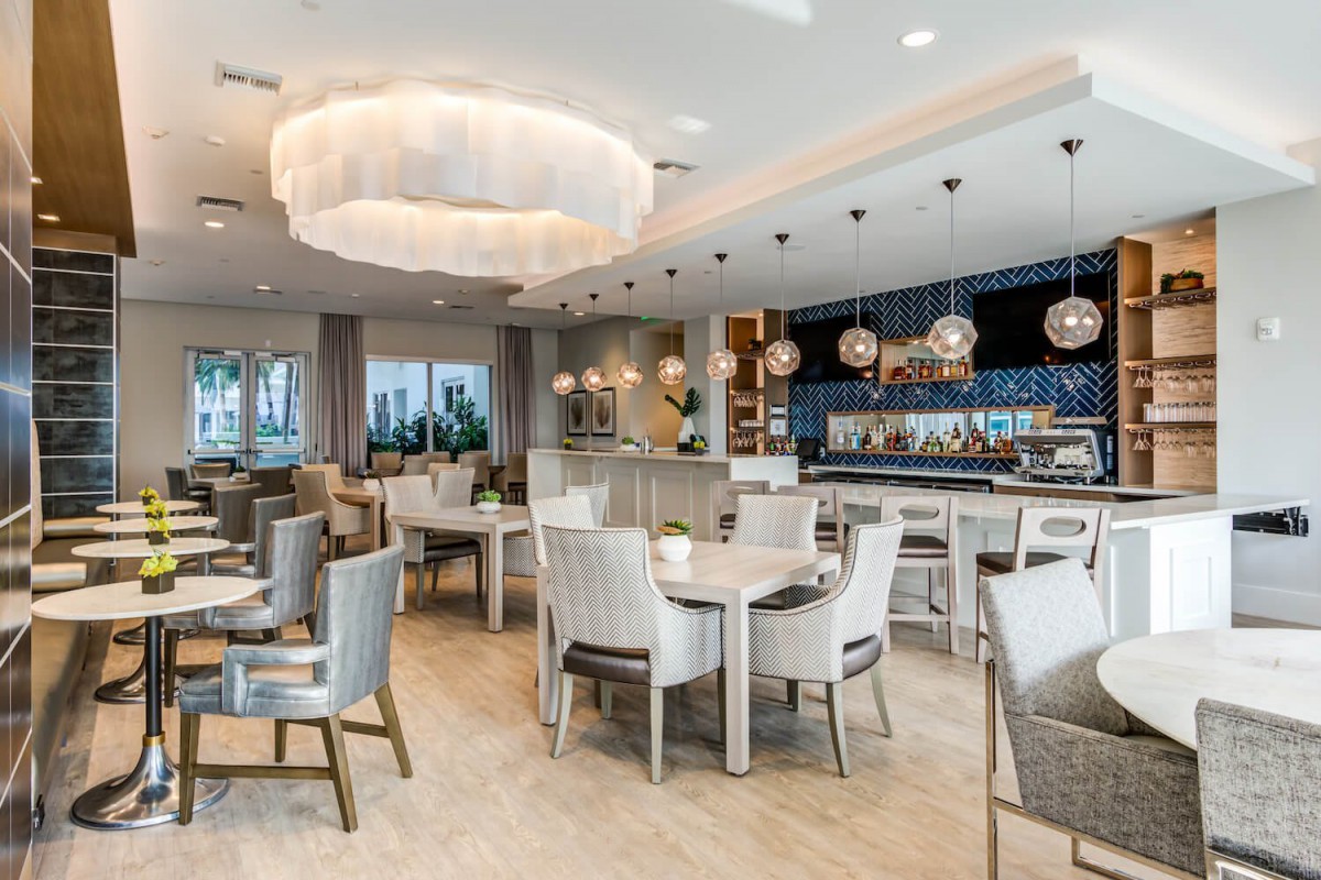 A modern restaurant interior with elegant decor and a well-lit dining area.