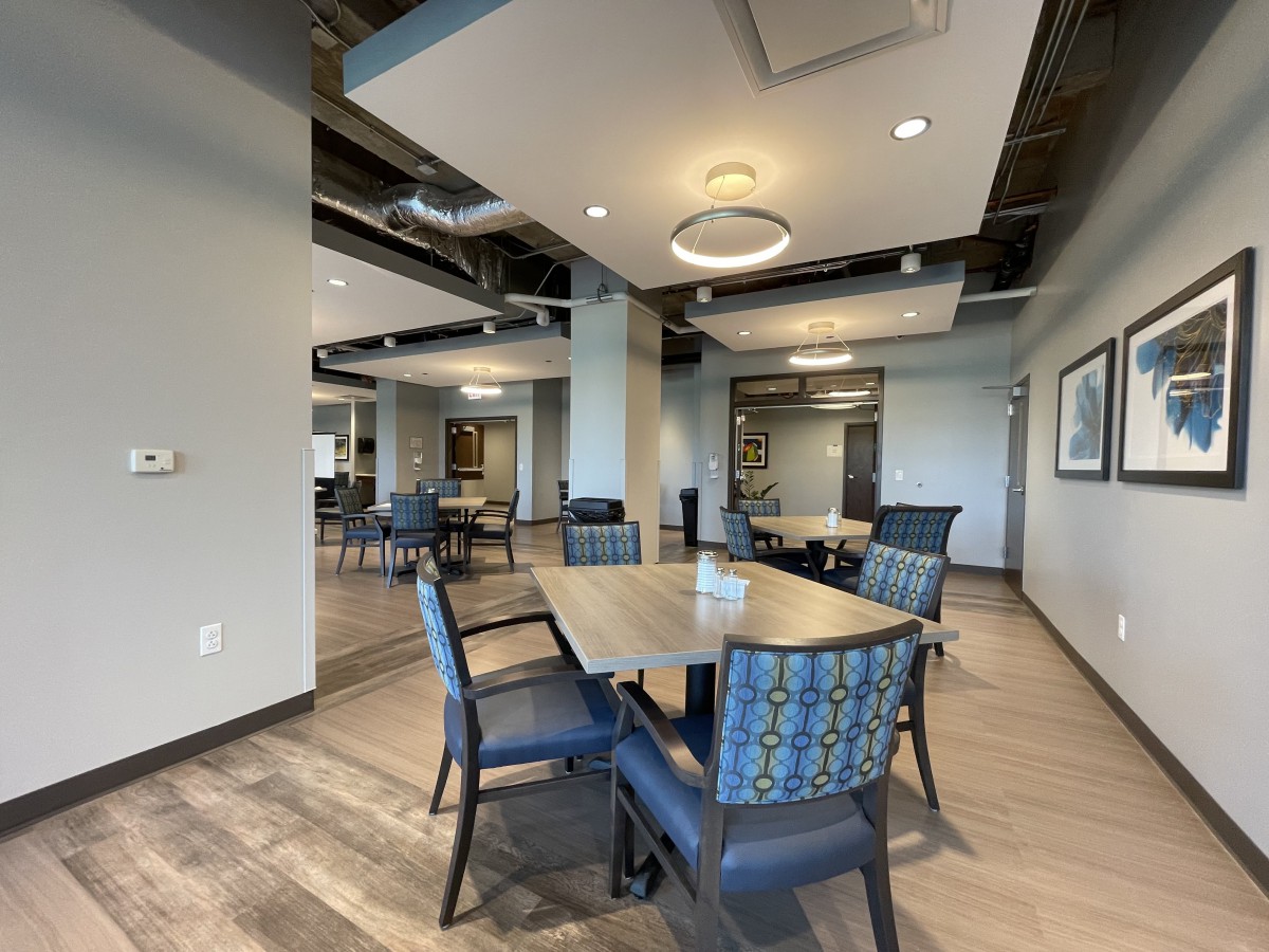A modern dining area with stylish furniture and contemporary lighting.