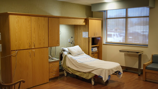 A well-equipped patient room in a modern hospital.