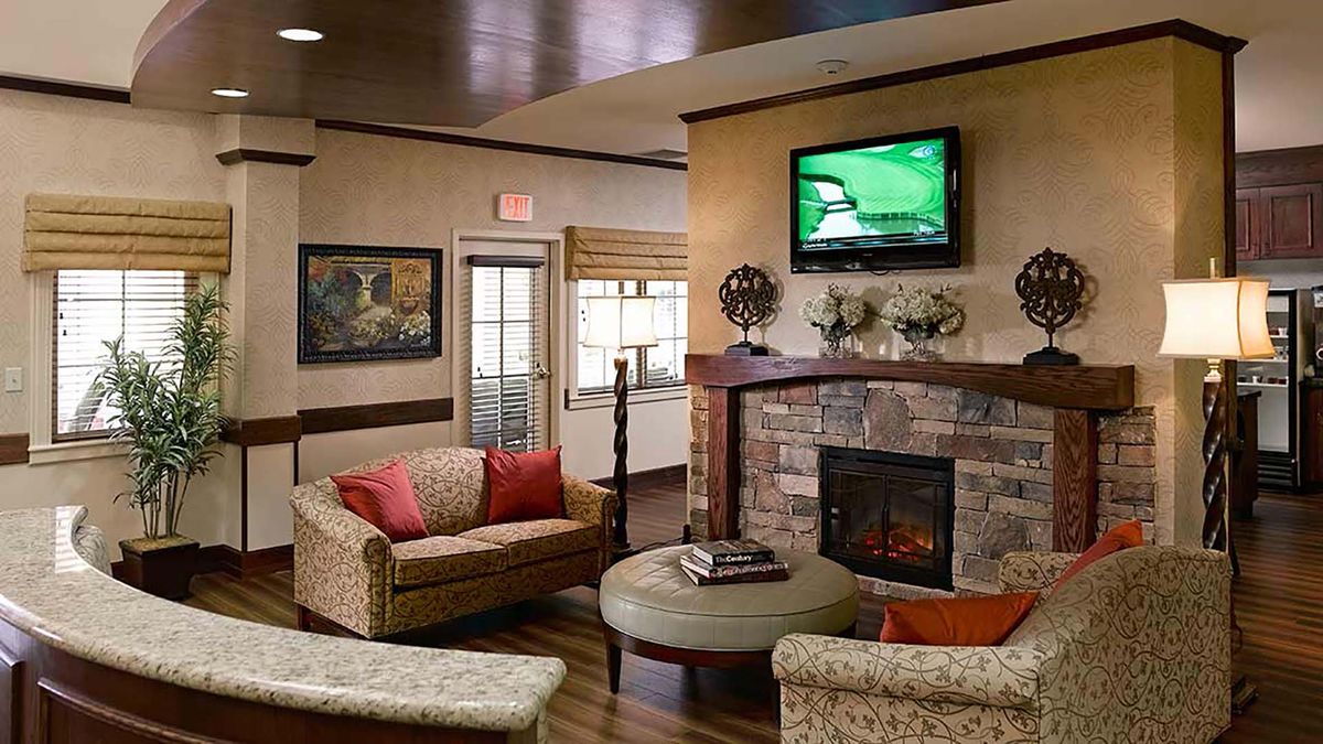 Cozy living room with a fireplace and television.