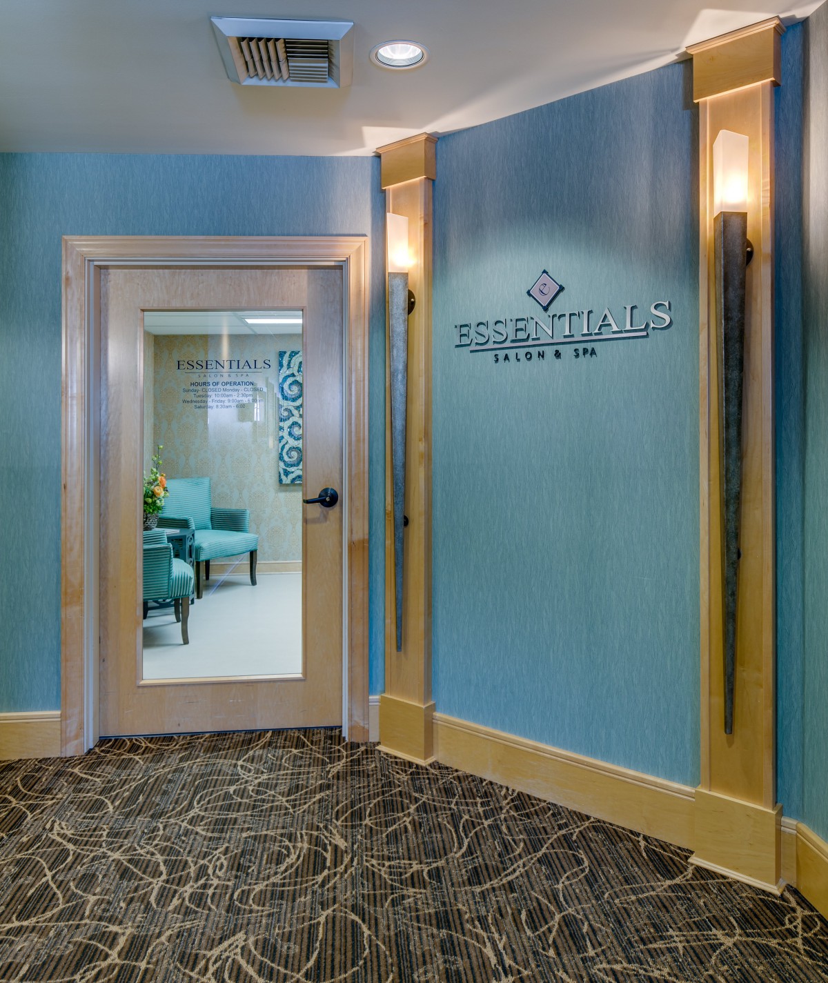 Entrance to a serene spa lobby with comfortable seating.