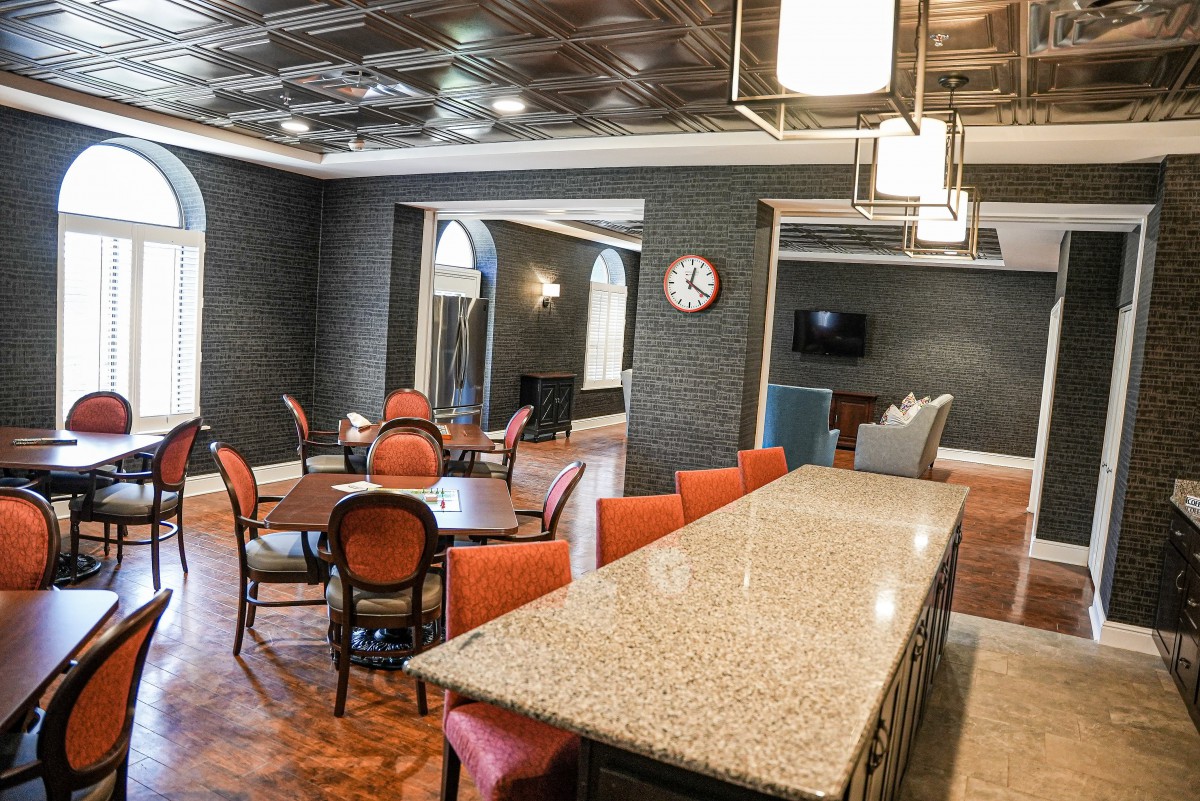 A modern dining area with elegant furniture and sophisticated lighting.