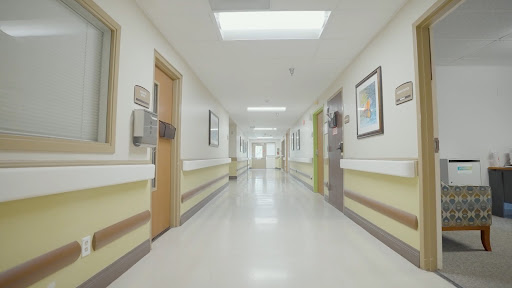 A clean and well-lit hospital hallway, showcasing a welcoming healthcare environment.