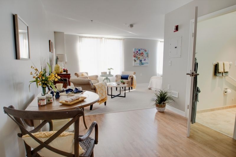 A cozy living and dining area with natural light and stylish decor.
