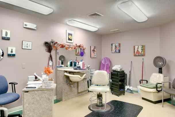 Interior view of a hair salon with chairs and mirrors.