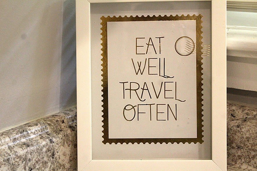 Inspirational framed quote: Eat well, travel often.