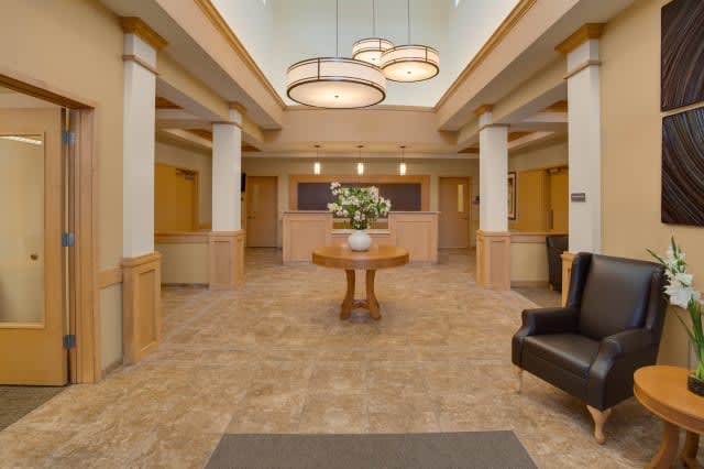 A spacious and elegantly designed lobby with contemporary lighting and decor.