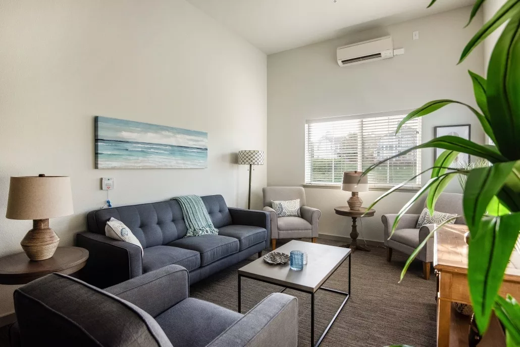 A modern living room with stylish furniture and natural light.
