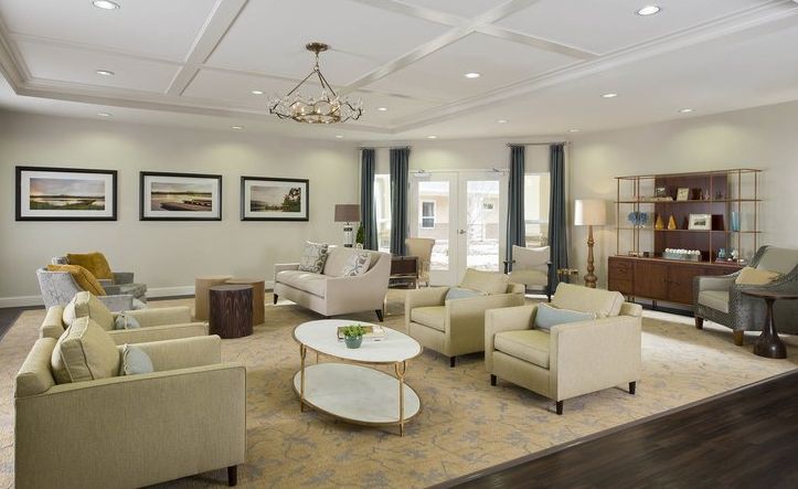 A modern living room with elegant furniture and bright lighting.