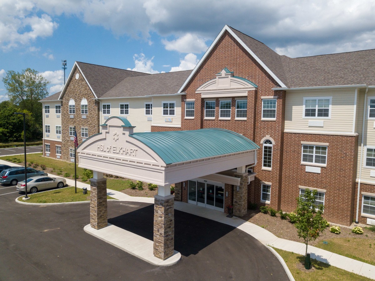 A modern commercial building with a covered entrance and attractive architectural design.