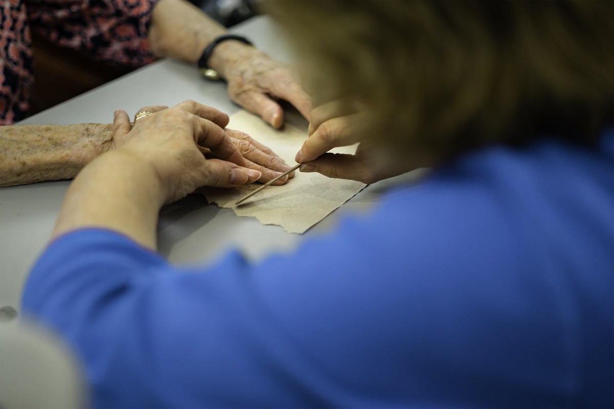 People working together on a paper crafting project.