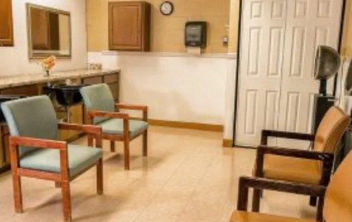 A quiet waiting room with several chairs and a clean interior.