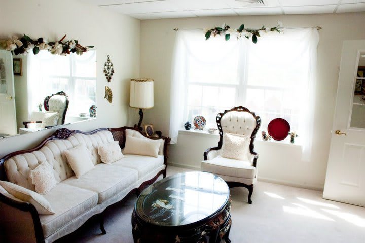 A bright living room with vintage-style furniture and decor.
