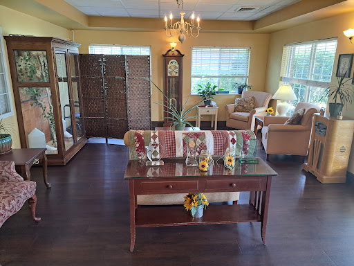 A cozy and well-decorated living room featuring warm colors and elegant furnishings.