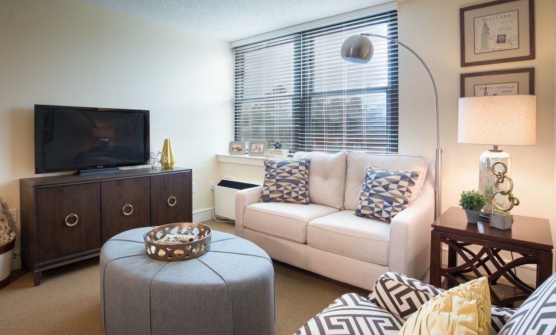 A modern living room with stylish furniture and a cozy atmosphere.