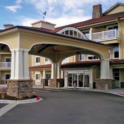 An inviting entrance to a large building, possibly a hotel or residence.